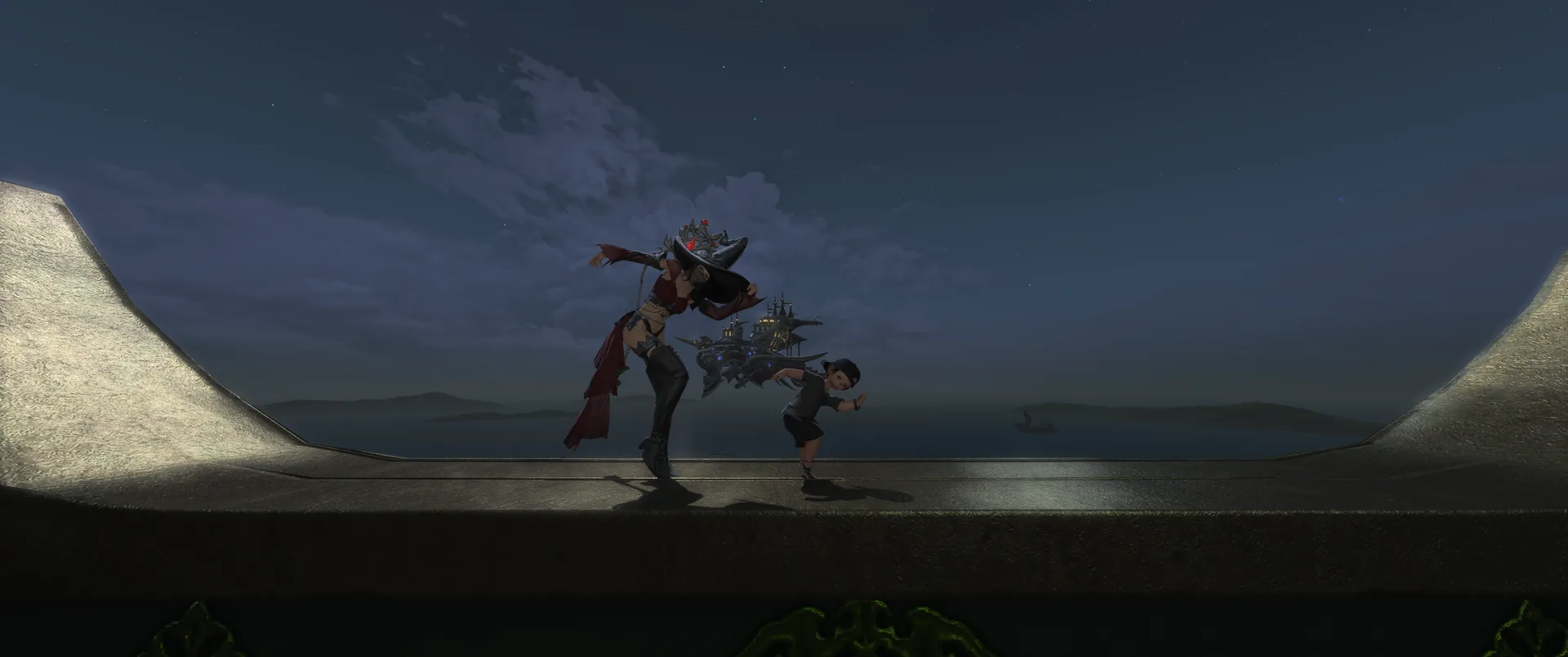 Two characters dancing on the narrow moonlit ledge at the top of the tower, lit from below, with the sea and distant islands stretching out behind them under a cloudy night sky.